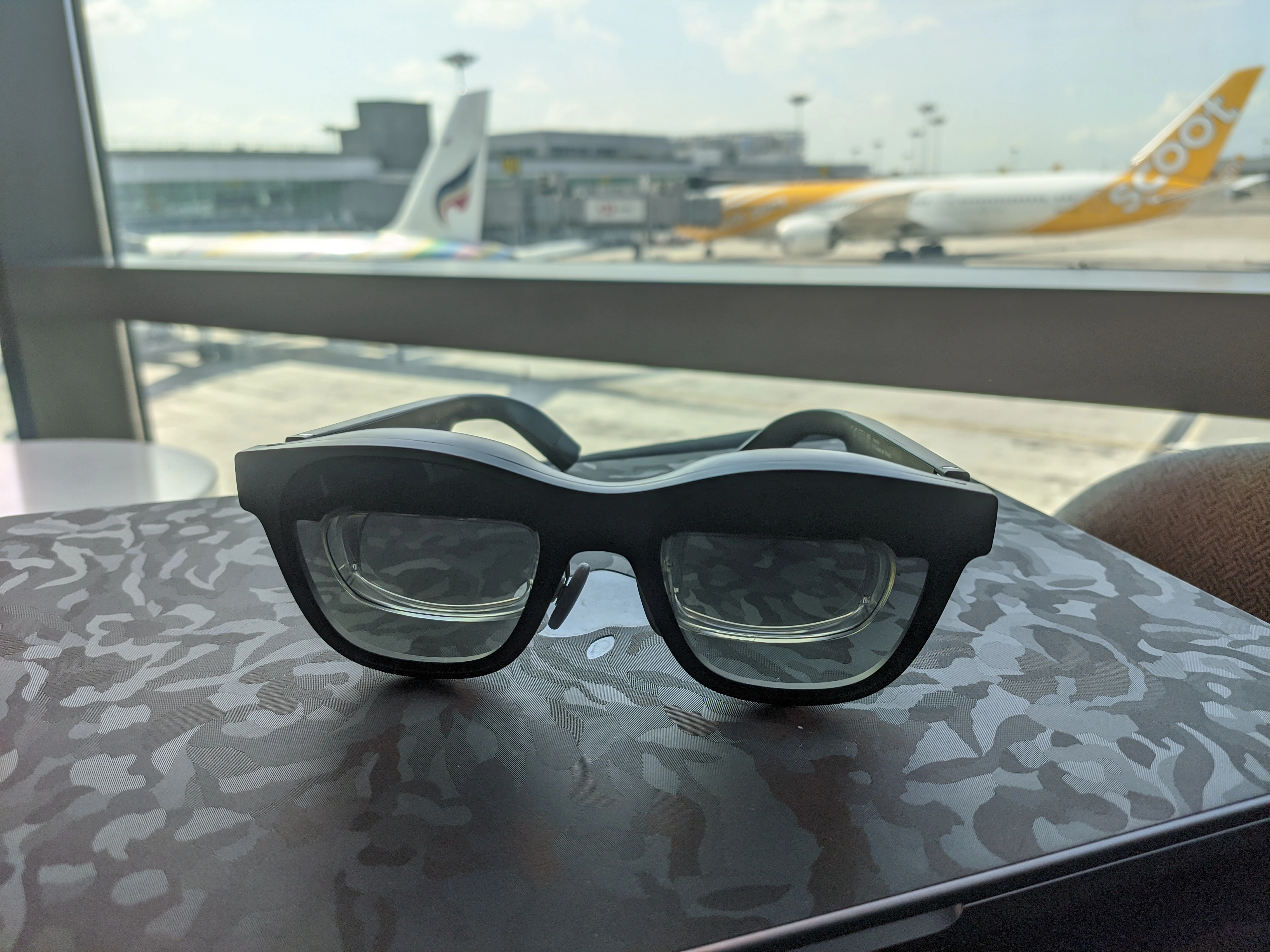 AR glasses and laptop in an airport